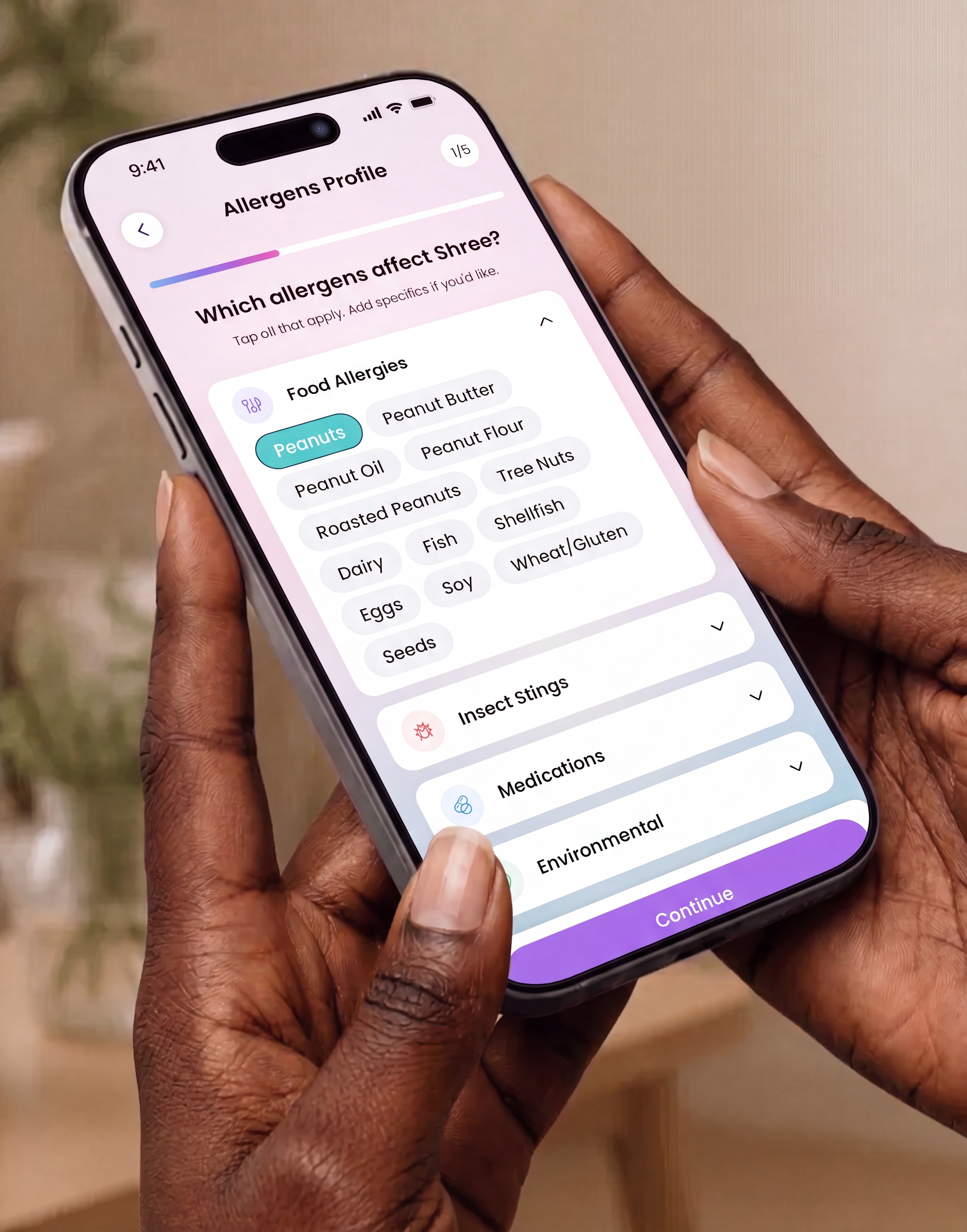 A parent holding a phone showing the Kiri allergy profile