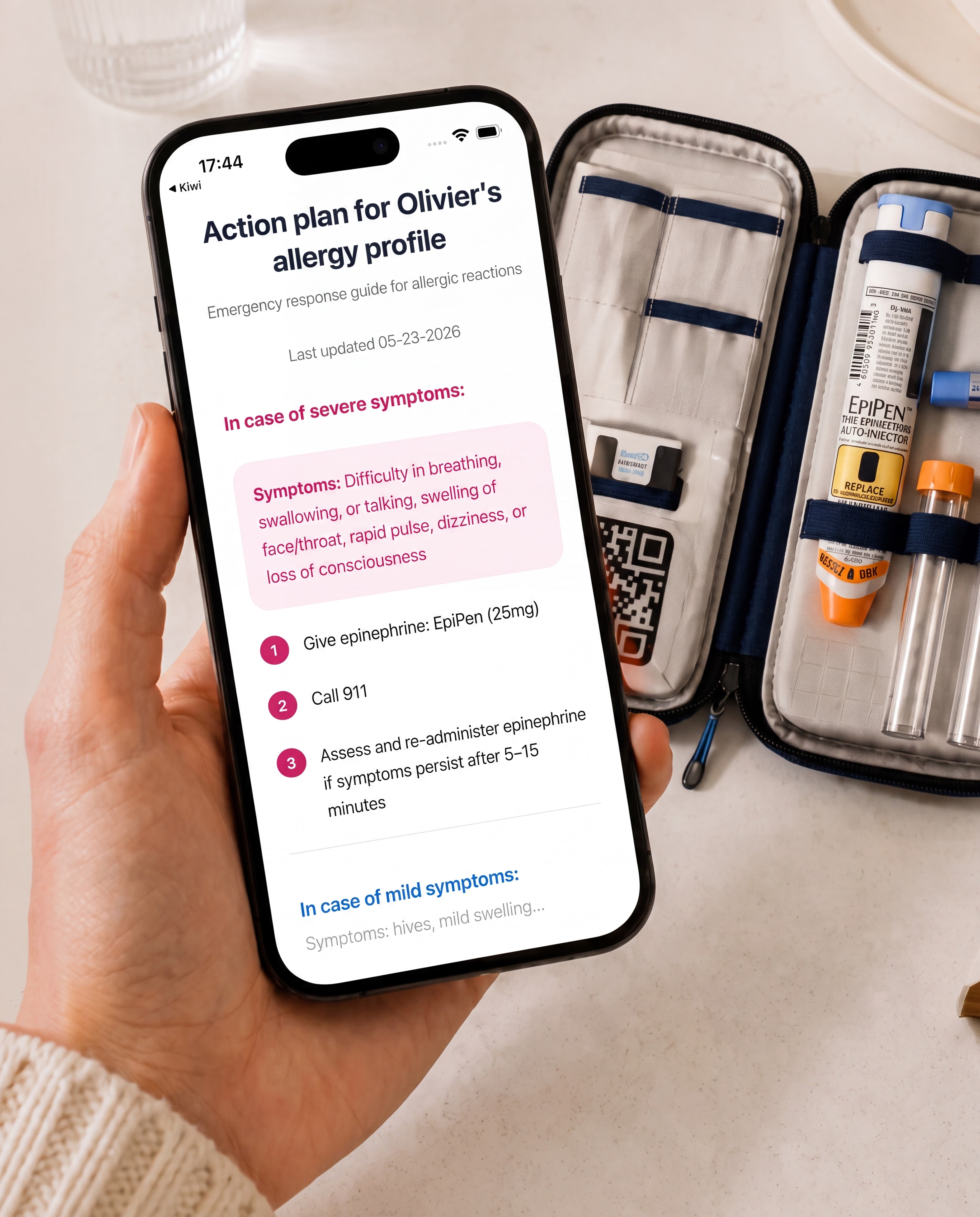 An open Kiri smart pouch beside a phone showing an allergy action plan