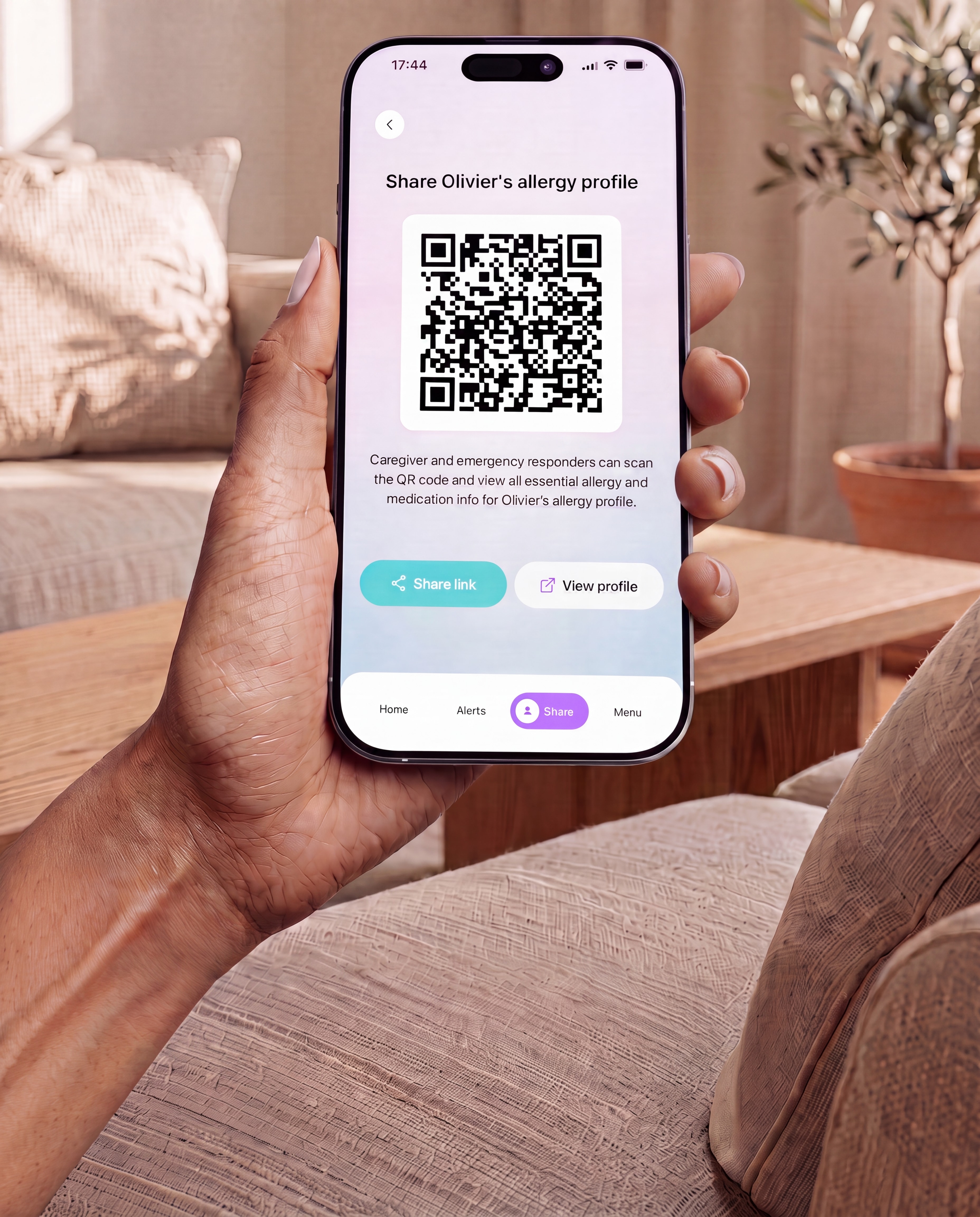 A hand holding a phone showing a scannable QR care profile
